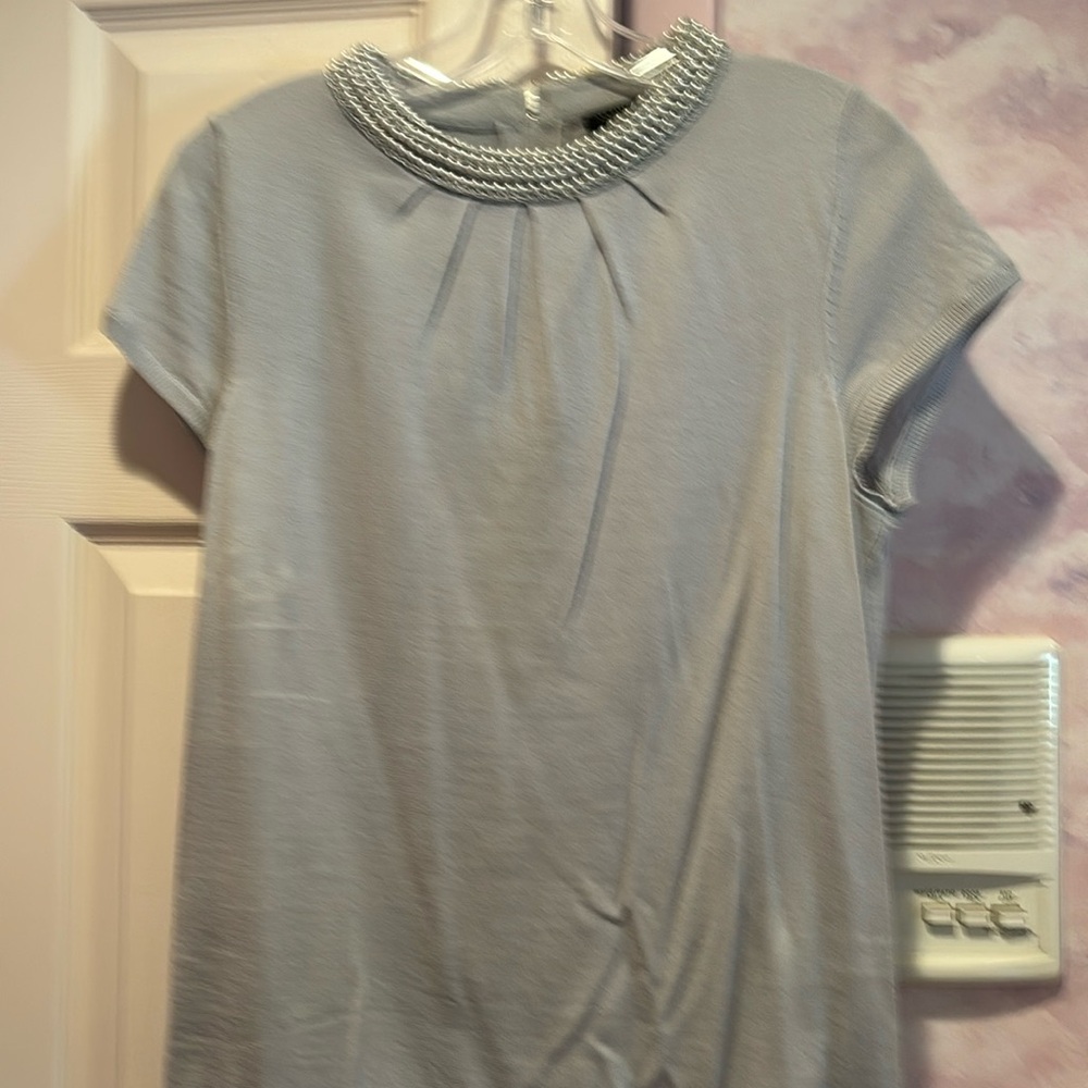 Grey knit sweater with pearl neckline